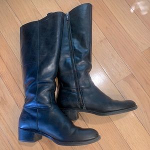 Tall leather riding boots.